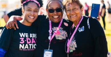 a group of women standing next to each other